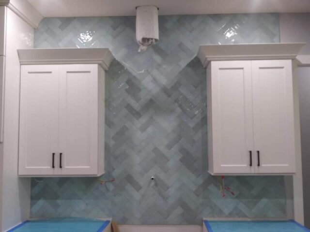 Custom herringbone tile backsplash installation by Rescue Remodeling in Palm Bay FL