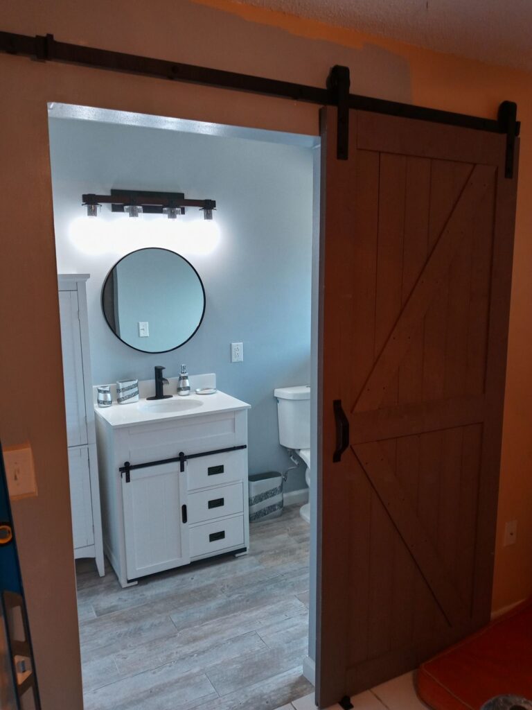 Bathroom remodel with barn door and new vanity
