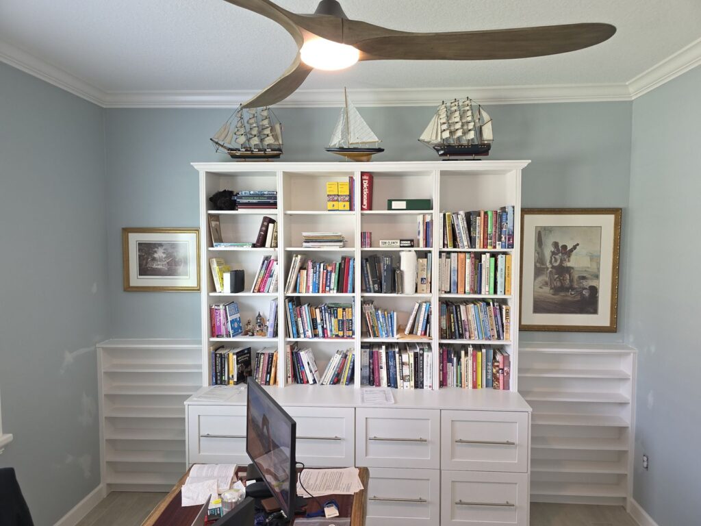 Built-in bookcase with drawers and crown