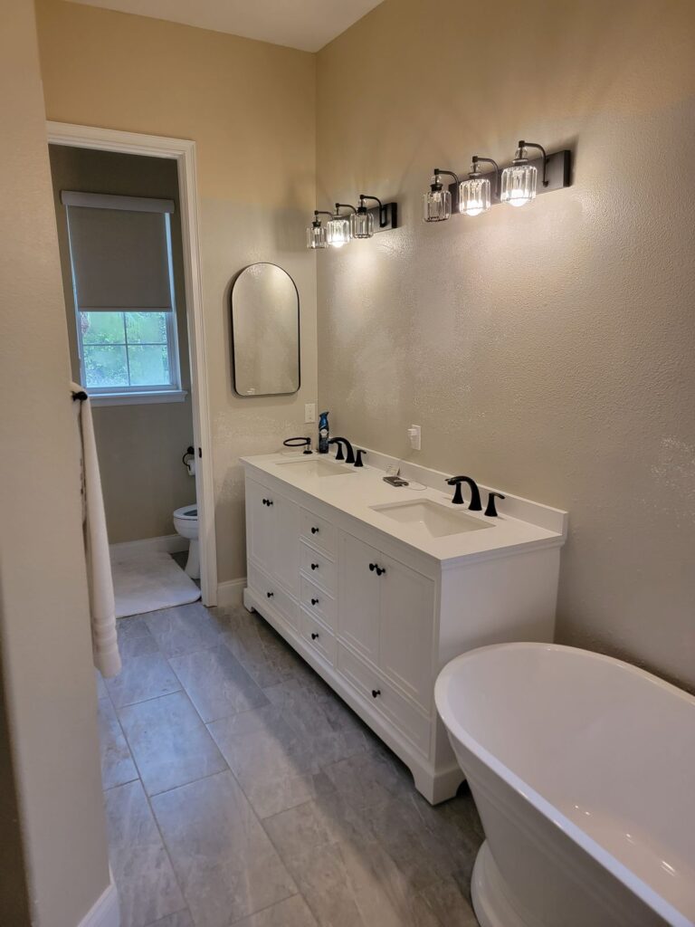Remodeled bath with white double vanity