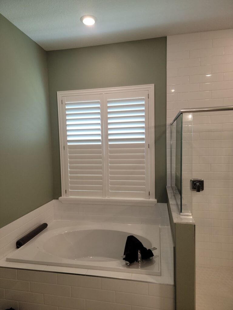 Garden tub surround with plantation shutters