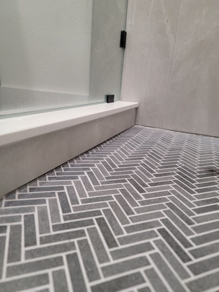 Herringbone tile shower floor detail