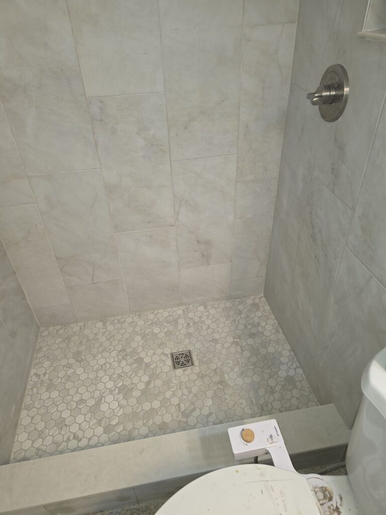 Hex mosaic shower floor and new wall tile