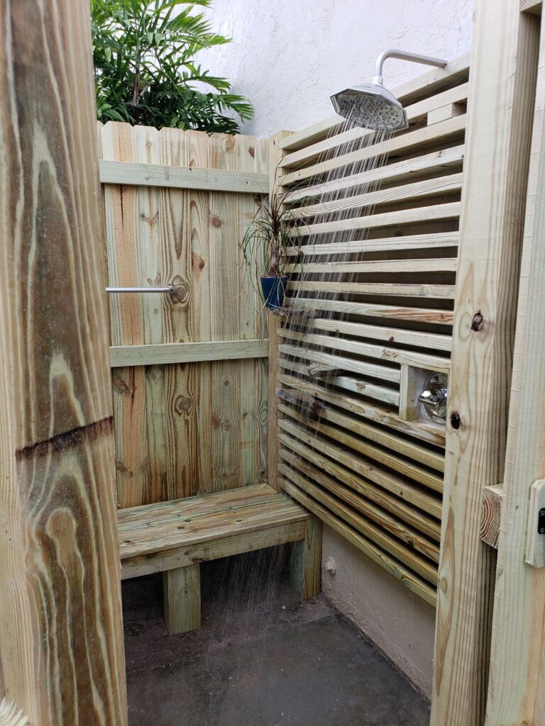 Outdoor shower with horizontal slat walls