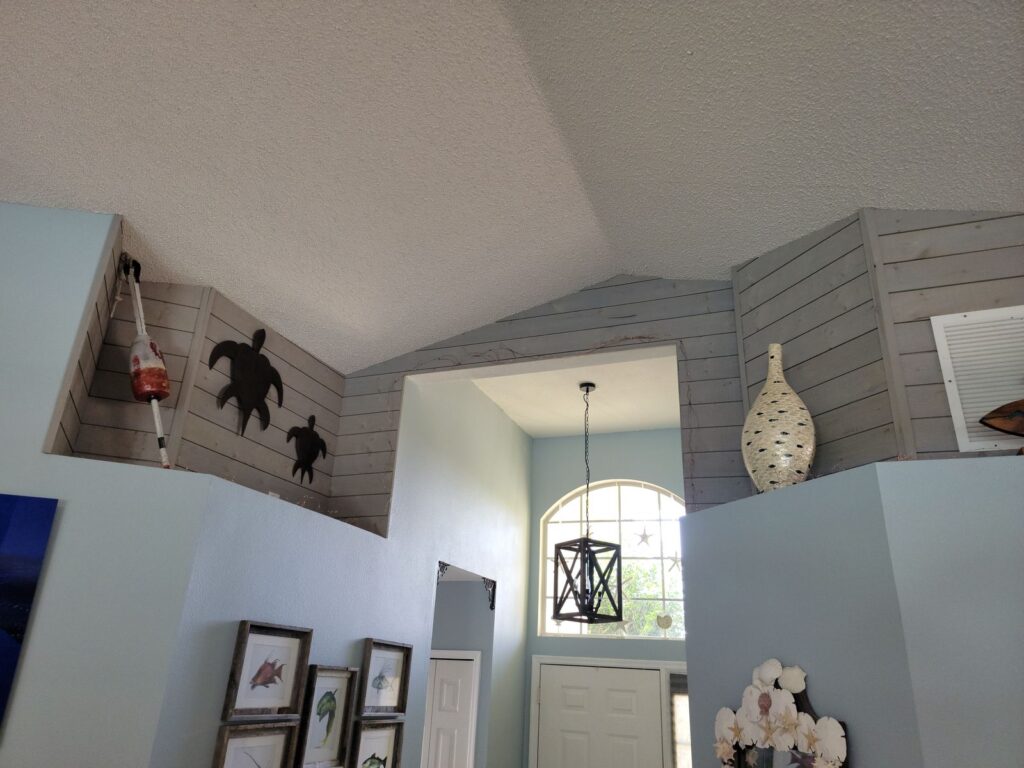 Shiplap accent wall on vaulted ceiling