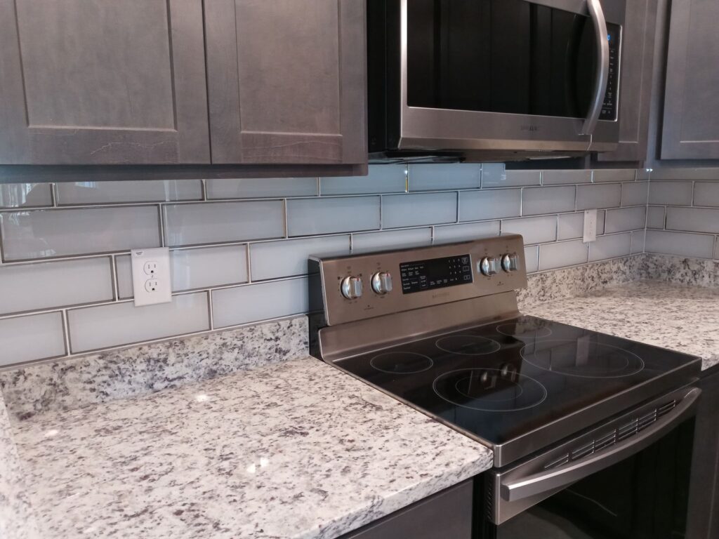 Subway tile backsplash installed behind the range