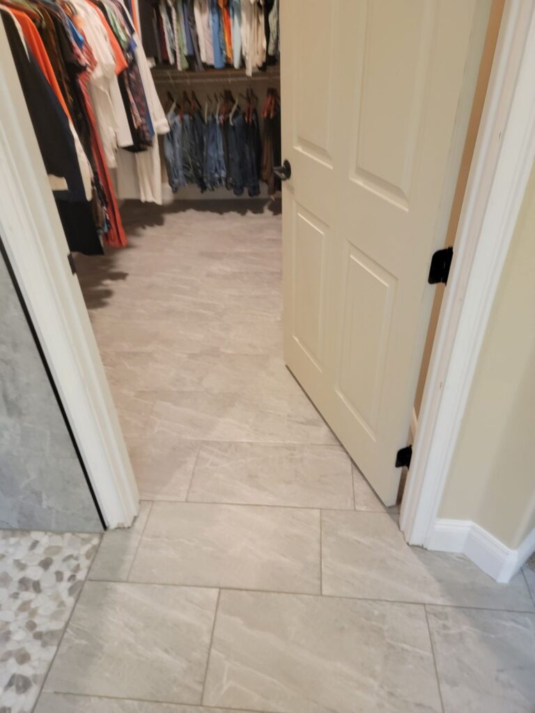 Tile floor continuing into closet doorway